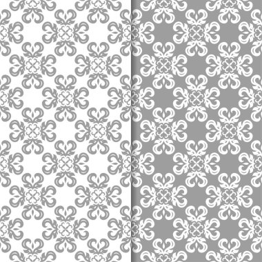 Beyaz ve gri çiçek süsler. Tekstil ve duvar kağıtları için sorunsuz arka planlar kümesi