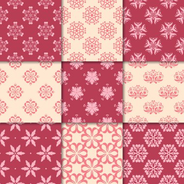 Kiraz kırmızı ve bej çiçekli süsler. Kağıt için dikişsiz desen koleksiyonu Tekstil