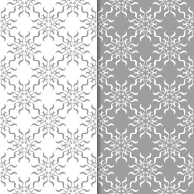 Beyaz ve gri çiçek süsler. Tekstil ve duvar kağıtları için sorunsuz arka planlar kümesi