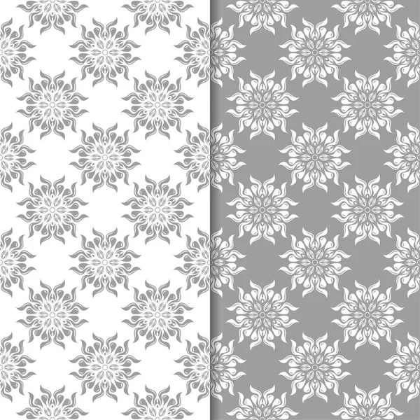 Beyaz ve gri çiçek süsler. Tekstil ve duvar kağıtları için sorunsuz arka planlar kümesi