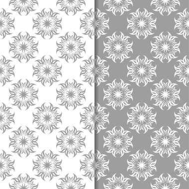 Beyaz ve gri çiçek süsler. Tekstil ve duvar kağıtları için sorunsuz arka planlar kümesi