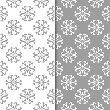 Beyaz ve gri çiçek arka planlar. Tekstil ve duvar kağıtları için dikişsiz desen seti