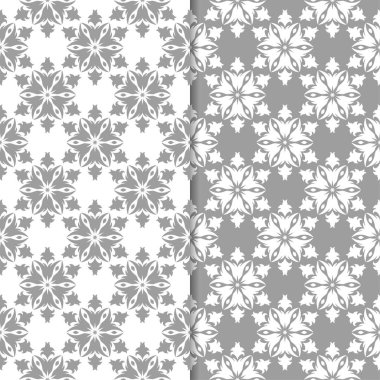 Beyaz ve gri çiçek süs tasarımlar. Tekstil ve duvar kağıtları için dikişsiz desen seti