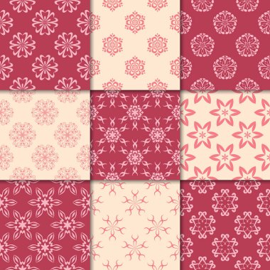 Kiraz kırmızı ve bej çiçekli süsler. Kağıt için dikişsiz desen koleksiyonu Tekstil