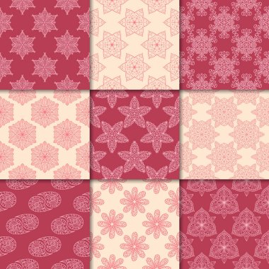 Kiraz kırmızı ve bej çiçekli süsler. Kağıt için dikişsiz desen koleksiyonu Tekstil