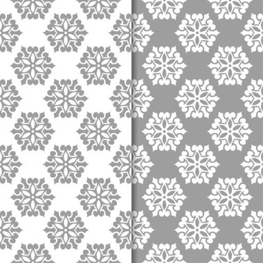 Beyaz ve gri çiçek arka planlar. Tekstil ve duvar kağıtları için dikişsiz desen seti
