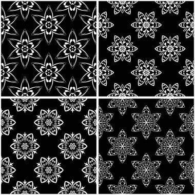 Çiçek desenleri. Siyah beyaz tek renkli kesintisiz arka planlar kümesi. Vektör çizim