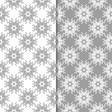 Beyaz ve gri çiçek süsler. Tekstil ve duvar kağıtları için sorunsuz arka planlar kümesi