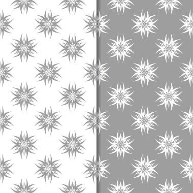 Beyaz ve gri çiçek süsler. Tekstil ve duvar kağıtları için sorunsuz arka planlar kümesi