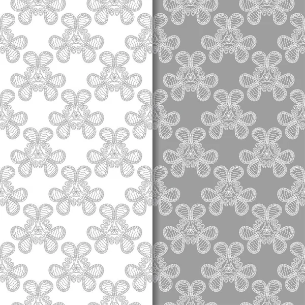 Beyaz ve gri çiçek süsler. Tekstil ve duvar kağıtları için sorunsuz arka planlar kümesi