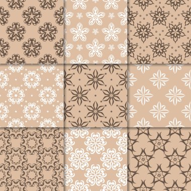 Kahverengi Bej çiçekli süsler. Kağıt için dikişsiz desen koleksiyonu Tekstil