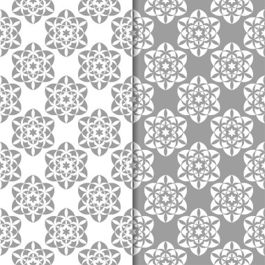 Beyaz ve gri çiçek süsler. Tekstil ve duvar kağıtları için sorunsuz arka planlar kümesi