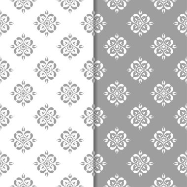 Beyaz ve gri çiçek süs tasarımlar. Tekstil ve duvar kağıtları için dikişsiz desen seti
