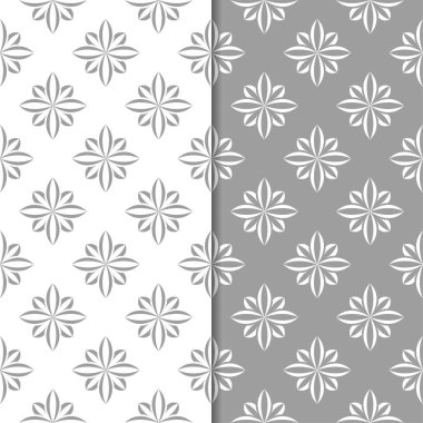 Beyaz ve gri çiçek süsler. Tekstil ve duvar kağıtları için sorunsuz arka planlar kümesi