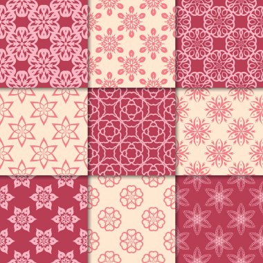 Kiraz kırmızı ve bej çiçekli süsler. Kağıt için dikişsiz desen koleksiyonu Tekstil