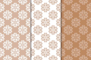 Kahverengi ve bej çiçek arka planlar kümesi. Tekstil ve duvar kağıtları için dikişsiz desen seti