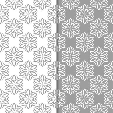 Beyaz ve gri çiçek süsler. Tekstil ve duvar kağıtları için sorunsuz arka planlar kümesi