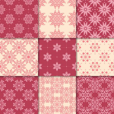 Kiraz kırmızı ve bej çiçekli süsler. Kağıt için dikişsiz desen koleksiyonu Tekstil