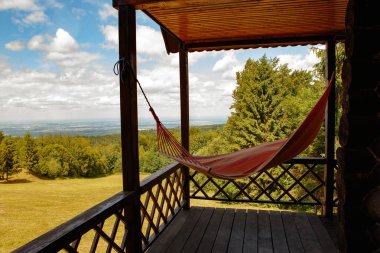 Green Backpack with Camping Gear in Open Field, Tourist and Military Style, Green Tourism Concept