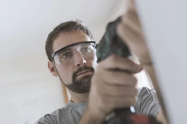 Professional Repairman Protective Goggles Using Drill Doing Home Renovation — Stock Photo, Image