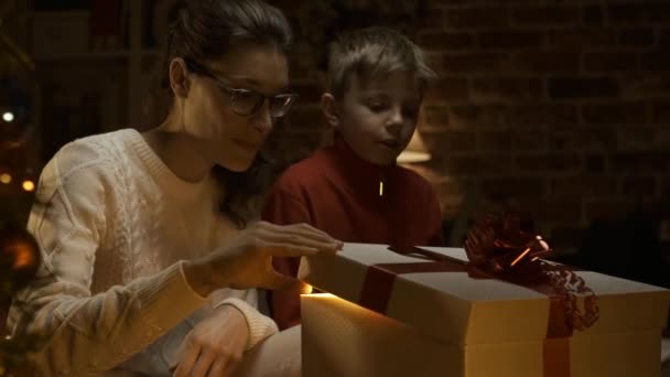 Happy Boy His Mother Opening Beautiful Christmas Gift Magical Surprise — Stock Video