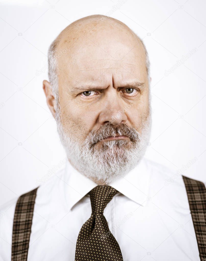 Disappointed sad senior man posing on white background, headshot