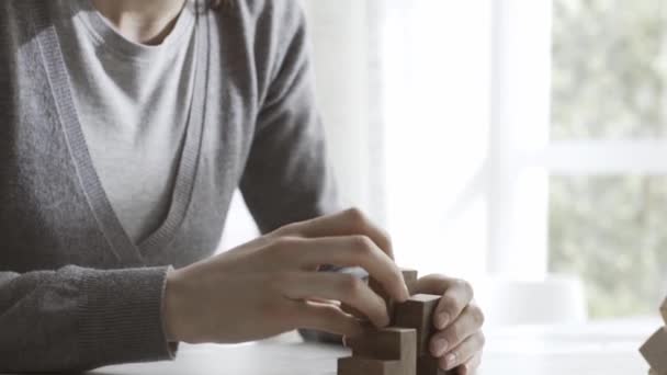 Woman Playing Wooden Brain Teaser Puzzle She Trying Put Pieces — Stock Video