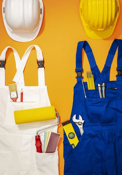 Repairman and painter work uniforms with tools