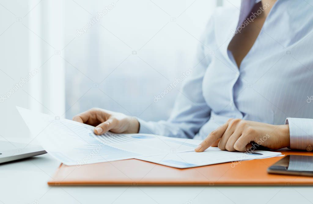 Professional corporate manager checking a financial report