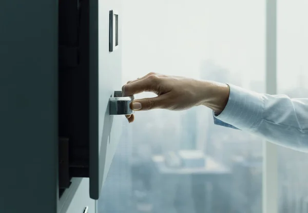 Secretary searching files in the filing cabinet — Stock Photo, Image