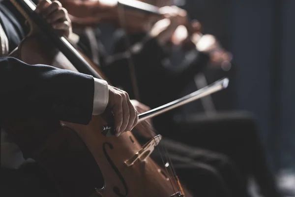 Symphonic orchestra performing on stage — Stock Photo, Image