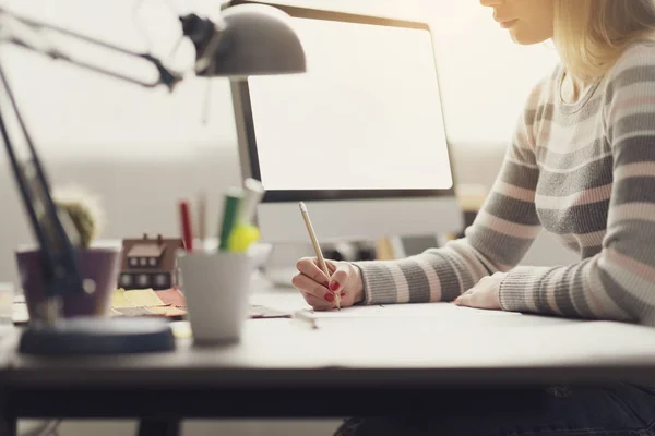 Young designer sketching with a pencil — Stock Photo, Image