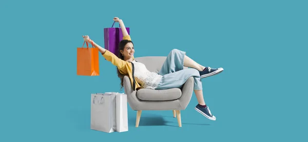 Cheerful shopaholic woman with shopping bags — Stock Photo, Image