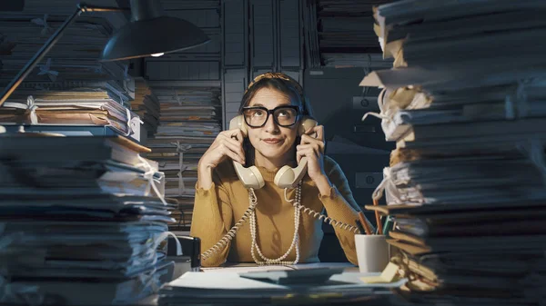 Bored secretary answering phone calls — Stock Image Bored secretary answering phone calls Stock Image