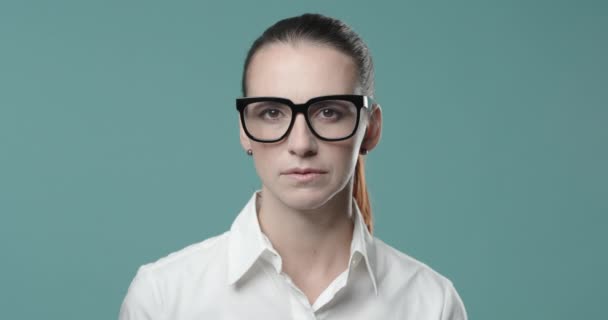 Smiling young businesswoman with glasses — Stock Video