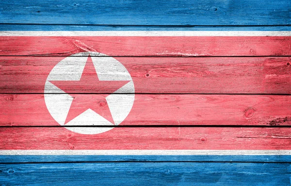 木製の板の背景に北朝鮮国旗 — ストック写真