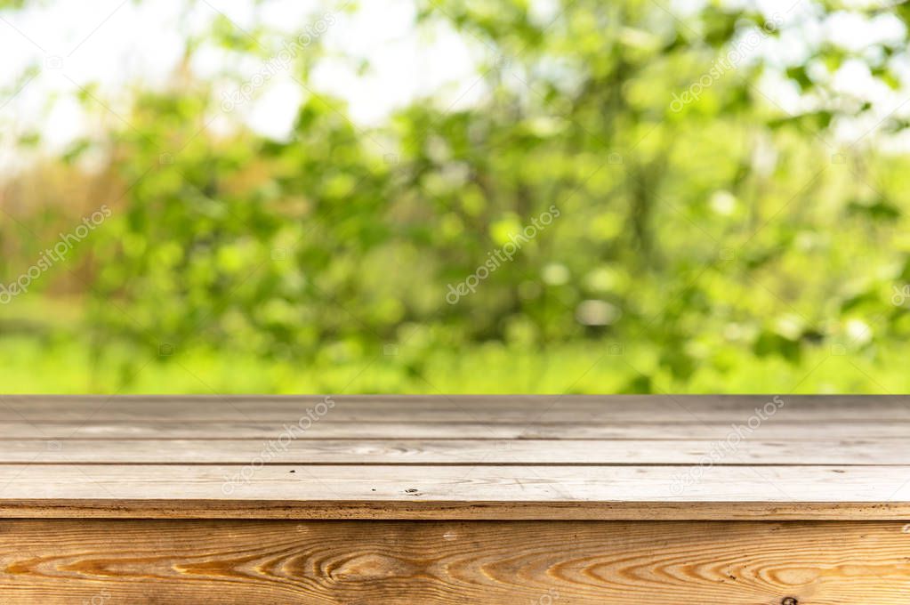 Empty wooden table with natural background