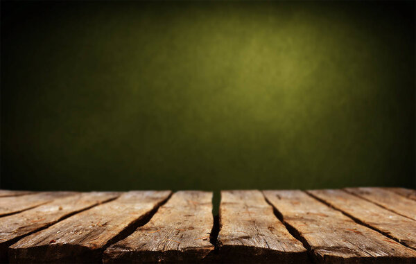 Empty wooden table with abstract background