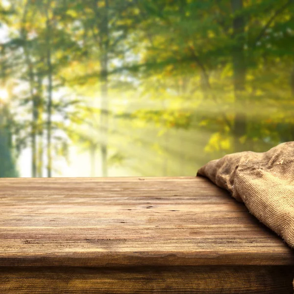 Empty wooden table with natural background