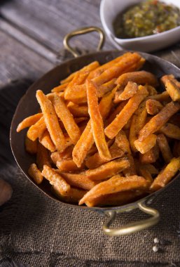 Close up view of delicious sweet potatoes fries clipart