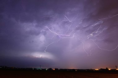 Thunderstorm over fields in Poland clipart