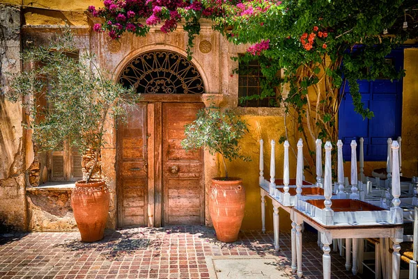 Traditional mediterranean backyard with old doors