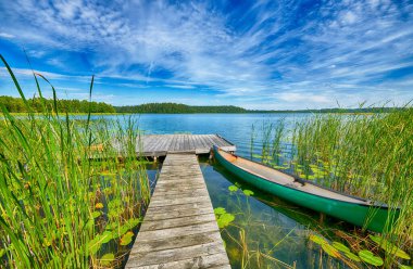 Beautiful summer day on masuria lake district in Poland clipart