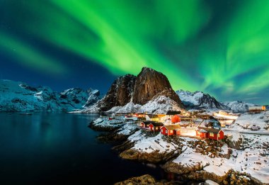 Aurora borealis over Hamnoy in Norway clipart