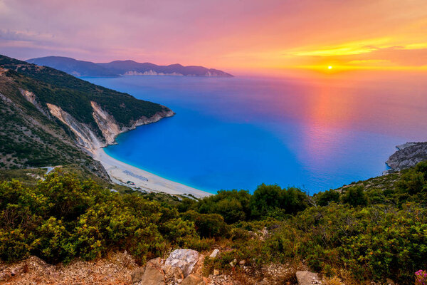 Beautiful summer sunset on Mirtos beach in Greece