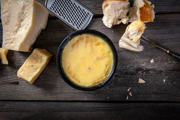 Swiss fondue melted cheese served with bread