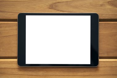Siyah tablet pc vintage ahşap masa arka plan boş beyaz ekran ile yakından mockup görüntü