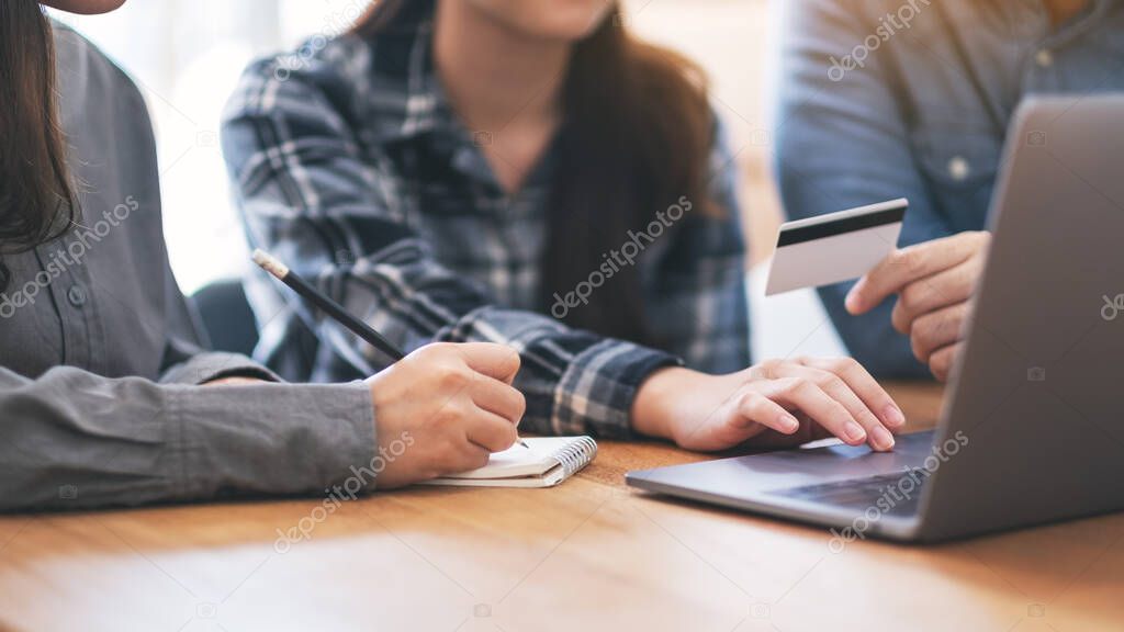 Businessman using credit card for purchasing and shopping online 