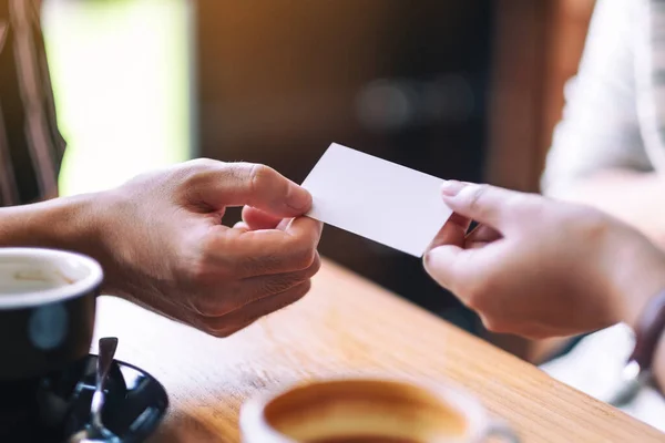 Two People Holding Exchanging Empty Business Card — Stock Photo, Image