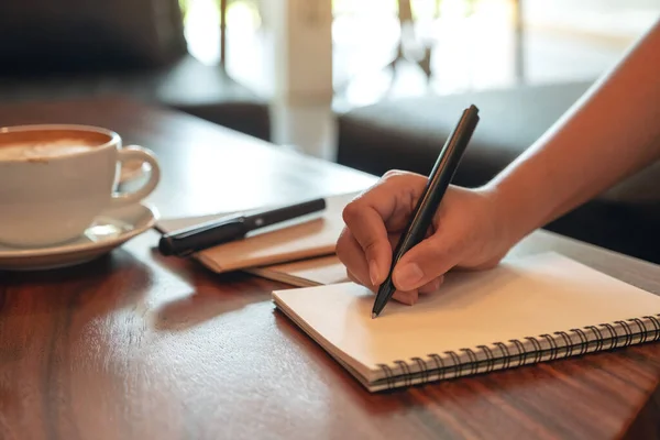 Closeup Image Hand Writing White Blank Notebook Coffee Cup Wooden — Stock Photo, Image